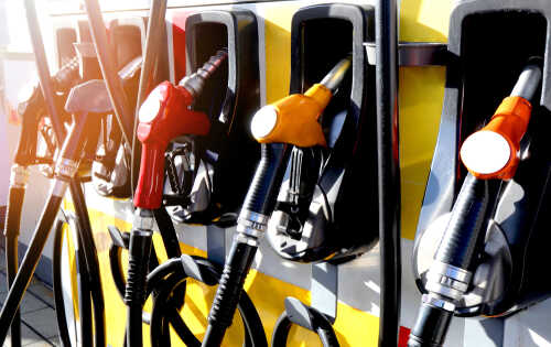 Close-up of multiple gas pumps at a fuel station