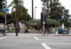 Intersection near MacArthur Park with traffic lights and palm trees