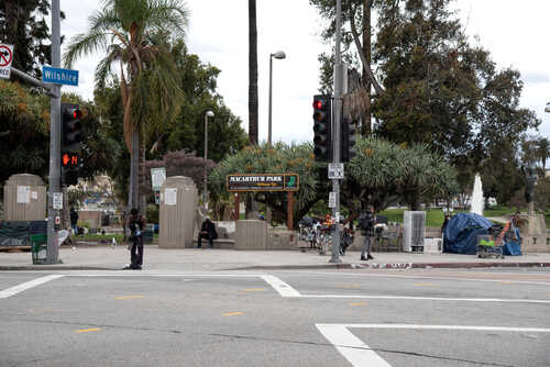 Intersection near MacArthur Park with traffic lights and palm trees