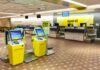 Self-service check-in kiosks at an airport for Spirit Airlines