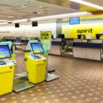 Self-service check-in kiosks at an airport for Spirit Airlines