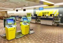 Self-service check-in kiosks at an airport for Spirit Airlines