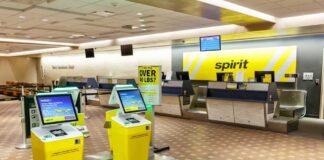 Self-service check-in kiosks at an airport for Spirit Airlines