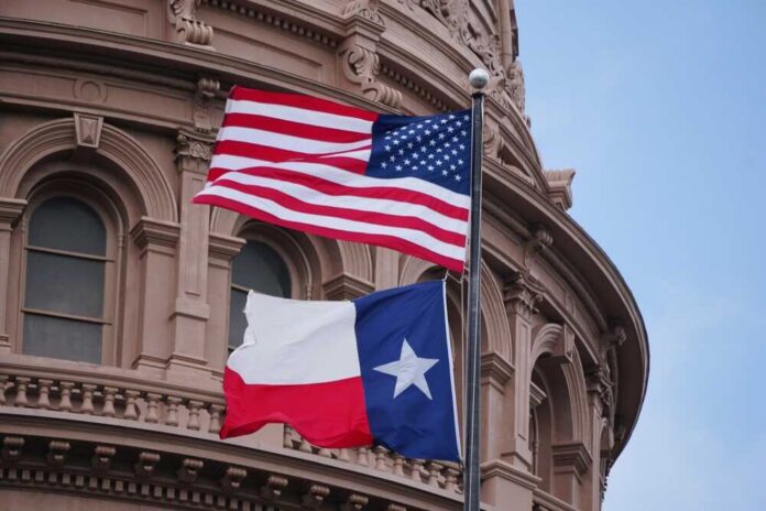 Austin,,Texas,,U.s.a,-,April,9,,2024,-,The,American American and Texas flags flying in front of a government building