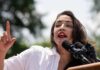 AOC SLAMS Supreme Court – Democracy at Risk? Capitol building with flags at dusk in cityscape