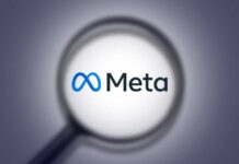 Magnifying glass focusing on the Meta logo