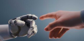 A robotic hand reaching out to touch a human hand