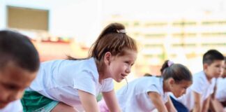 Children preparing to race on a track