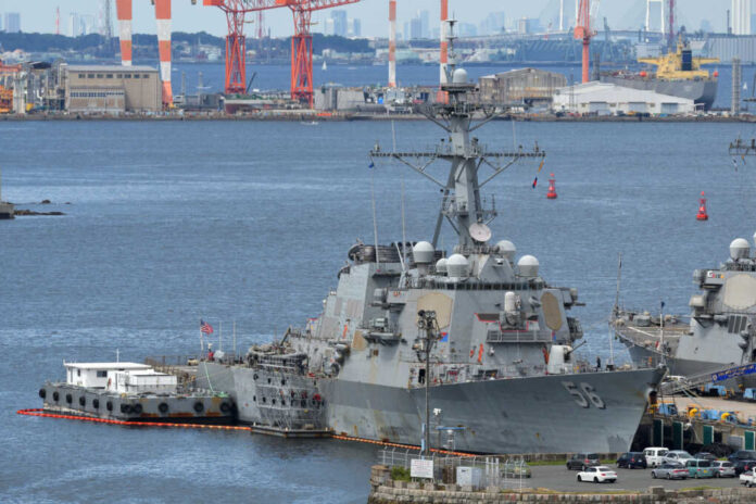 us-destroyer2044422392jpg-1 naval destroyer moored at a busy harbor
