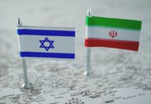 Ceasefire Claim, War Footage Says Otherwise Mini flags of Israel and Iran on map