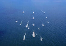 China Steps Up Pressure On Taiwan Aerial view of multiple naval ships operating in the ocean