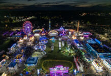 State Fair Crowd Claims Spark New Debate Nighttime aerial view of a brightly lit carnival with rides and crowds