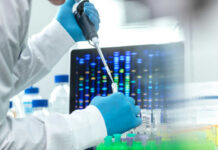 Scientist with pipette in front of DNA sequences
