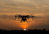 Russia-Linked Spy Ring Targeting NATO Industry A drone flying against a sunset background