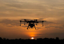 Russia-Linked Spy Ring Targeting NATO Industry A drone flying against a sunset background