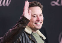 One IPO Changed Everything Overnight Man in leather jacket smiling and waving