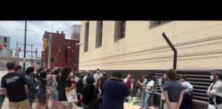 People protest at federal courthouse against FBI raid