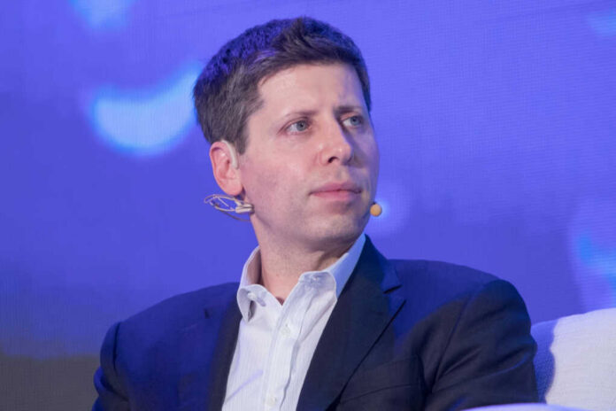Man in suit with headset microphone on stage