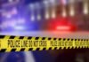 Grease, Blades, Chaos—Worker Ambushed Yellow police caution tape with the text 'POLICE LINE DO NOT CROSS' in a blurred background