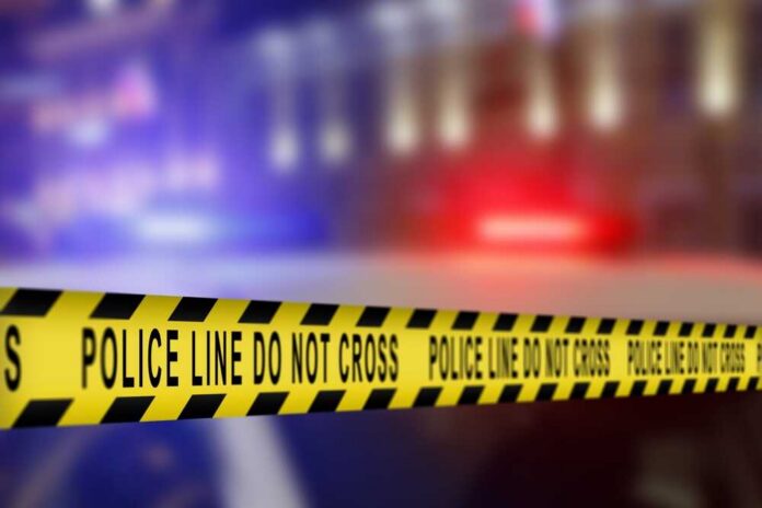 Yellow,Tape,Showing,Text,"police,Line,Do,Not,Cross",Restricting Yellow police caution tape with the text 'POLICE LINE DO NOT CROSS' in a blurred background