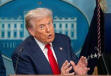 Judge Refuses To Block Trump Order A government official speaking passionately at a press conference