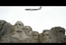 A Symbol Of American Strength Soared Above Trump arrives after Mt. Rushmore flyover by Air Force One as part of America 250 event