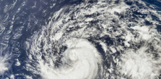 Tropical cyclone swirling over the ocean