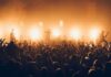 One Concert Joke Sparked A White House Response Rock band performing on stage with bright backlights and cheering crowd