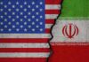 A High-Stakes Deadline Nears Its End Split image of United States and Iran flags divided by a cracked seam