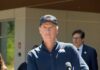 Newsom’s Tax Plan Targets America’s Wealthiest Politician speaking at a press conference outdoors