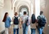 White House Broadside: Gen-Z Called ‘Lazy’ Group of students walking through a university corridor