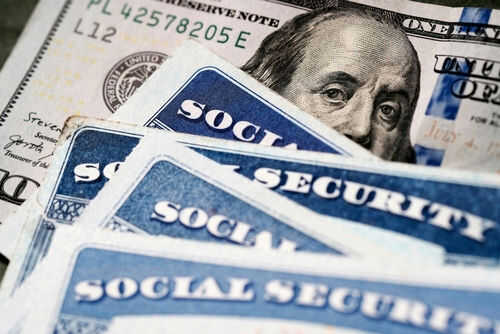 social-security-2284672193 Social Security cards with one hundred dollar bill