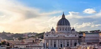 St Peters Basilica with surrounding cityscape at sunset
