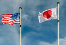 Yen Freefall: Washington Pulls Rare Lever USA and Japan flags flying on flagpoles.