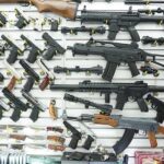 Wall display of assorted firearms in a gun shop
