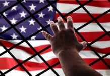 Bill Maher’s Immigration Take Turns Heads Hand reaching through fence toward American flag
