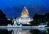 United States Capitol building at dusk with lights glowing