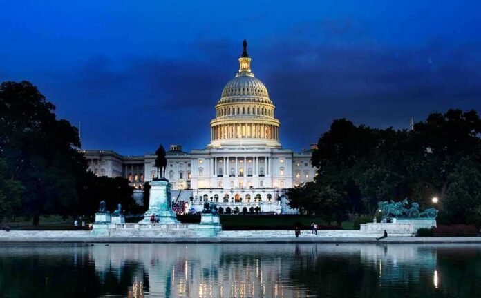 shutterstock_1134028949 United States Capitol building at dusk with lights glowing