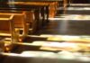 The FBI’s Catholic Controversy Just Got Bigger Wooden church pews with stained glass light on the aisle