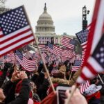 Crowd waving American flags near the U.S. Capitol