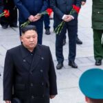 Kim’s Latest Warning Shot Comes Right on Cue man in black coat at formal ceremony