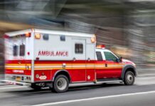 A Deadly Battery Threat Strikes New York Again Ambulance speeding down a city street with lights flashing
