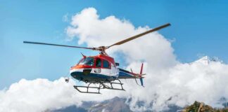helicopter flying over mountain landscape