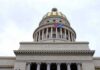 Cuba Becomes Trump’s Next Test Of Strength Capitol building dome with columns and a flag