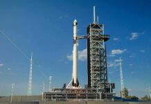 Rocket on launch pad under clear blue sky