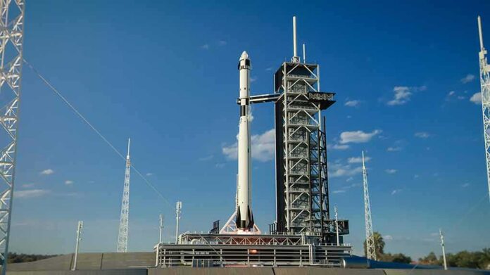 Rocket on launch pad under clear blue sky