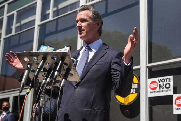 shutterstock_2041539359 man in suit speaking at outdoor press conference