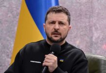 Kyiv Denies It as Prosecutors Close In man holding a microphone during a talk