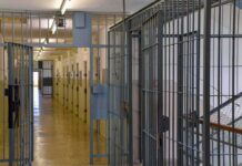 Illinois Board Says No—Death Follows Prison corridor with barred doors