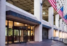 Power Play: President Above Records Law? J. Edgar Hoover FBI Building entrance with American flags